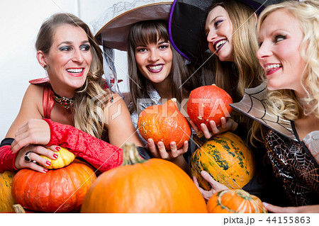 Four beautiful women acting as witches joining their malicious forces Four beautiful women acting as witches joining their malicious forces 44155863