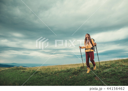 Nice young female tourist trying scandinavian walking 44156462