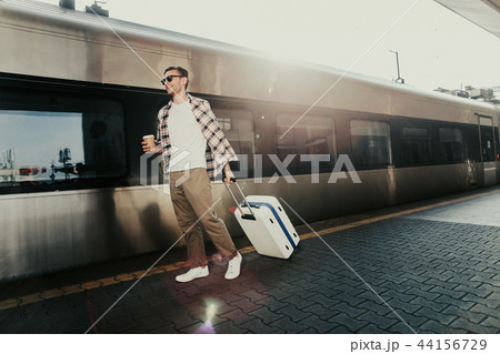 Happy male walking on platform before trip 44156729