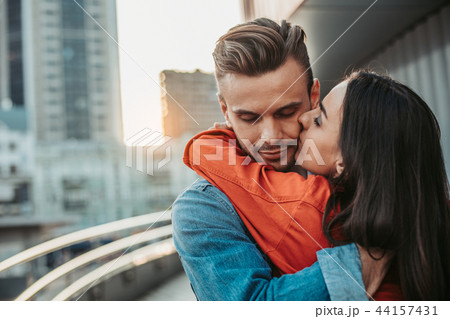 Positive lady hugging glad man during rest Positive lady hugging glad man during rest 44157431
