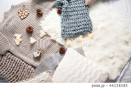 Warm clothes situating on floor on carpet Warm clothes situating on floor on carpet 44158385