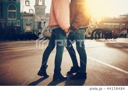 Young loving couple standing close to each other on the street Young loving couple standing close to each other on the street 44158484