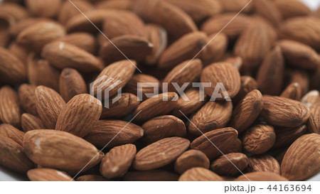 closeup roasted almonds background closeup roasted almonds background 44163694
