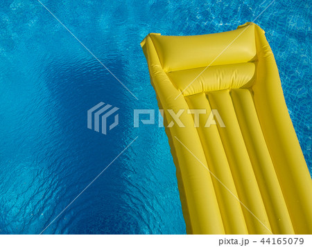Top view of inflatable mattress in swimming pool Top view of inflatable mattress in swimming pool 44165079
