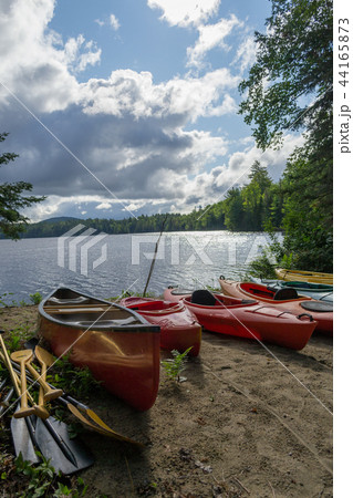 Kayaks and a canoe by the Indian lake Kayaks and a canoe by the Indian lake 44165873