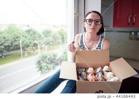 girl eating tasty cakes, sweet food and pleasure 44166493