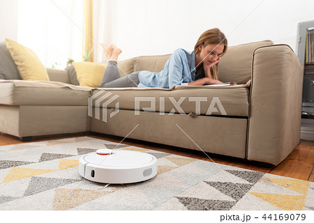 Robotic vacuum cleaner cleaning the room Robotic vacuum cleaner cleaning the room 44169079