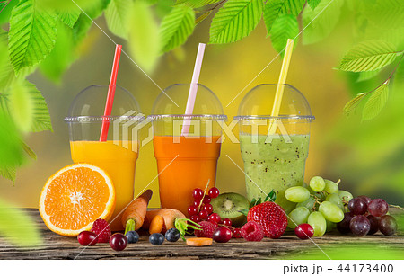 Fresh juice mix fruit, healthy drinks on wooden table. 44173400