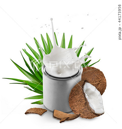 close-up of a coconuts with milk splash and can. close-up of a coconuts with milk splash and can. 44173956
