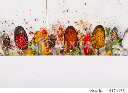 Various colorful spices on wooden table Various colorful spices on wooden table 44174166