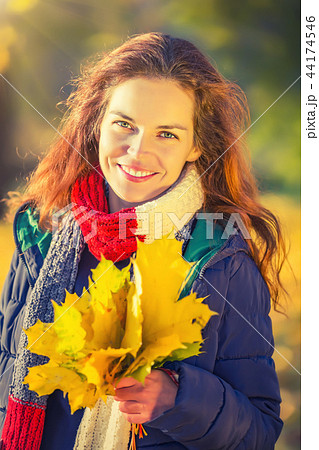 Portrait of young beautiful woman in autumn park Portrait of young beautiful woman in autumn park 44174546