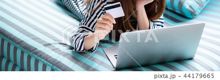 Banner website beautiful woman lying use laptop Banner website beautiful woman lying use laptop 44179665