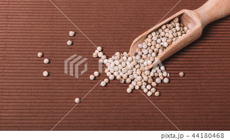 spicy pepper in a wooden bowl spicy pepper in a wooden bowl 44180468