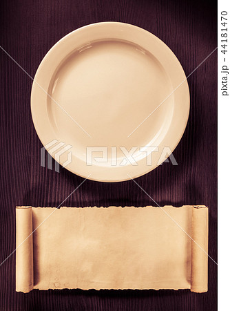 plate and scroll on wood plate and scroll on wood 44181470