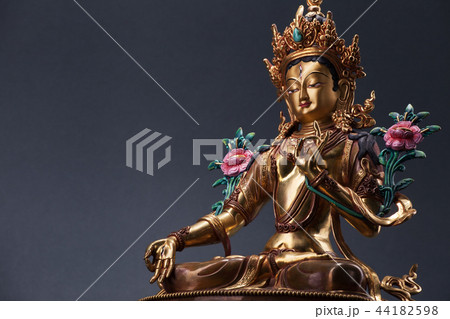 Bronze figurine of a green Tara with copyspace. Bronze figurine of a green Tara with copyspace. 44182598
