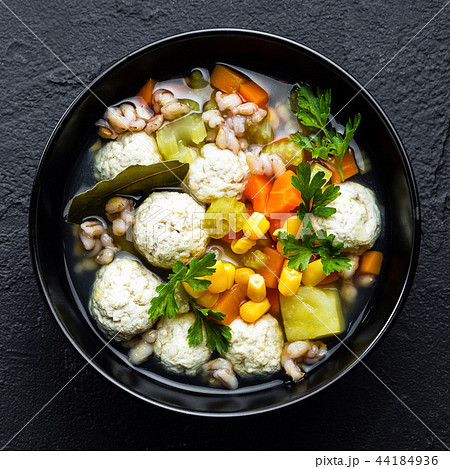 Delicious vegetable soup with chicken meatballs Delicious vegetable soup with chicken meatballs 44184936