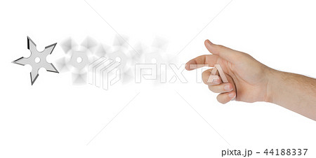 Hand is throwing ninja shuriken 44188337