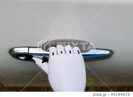 Travel technology robot hand driving a car 44194629