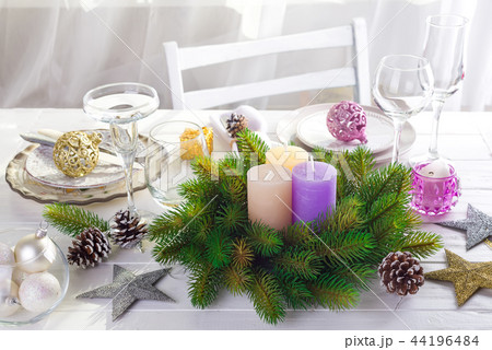 Christmas wreath with colorful big candles Christmas wreath with colorful big candles 44196484