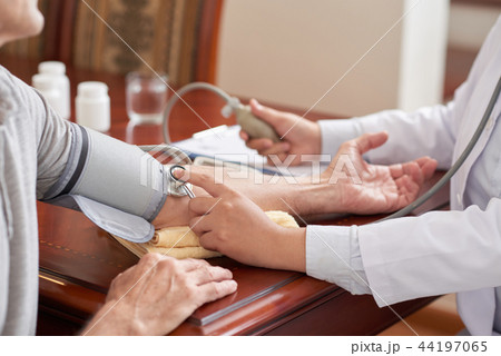 Checking blood pressure 44197065