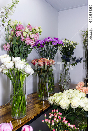 Colorful different flowers in vase at flower shop Colorful different flowers in vase at flower shop 44198869