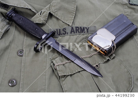 M16 rifle bayonet on uniform background M16 rifle bayonet on uniform background 44199230