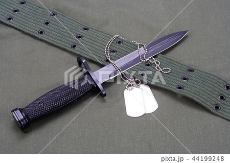 M16 rifle bayonet on uniform background M16 rifle bayonet on uniform background 44199248