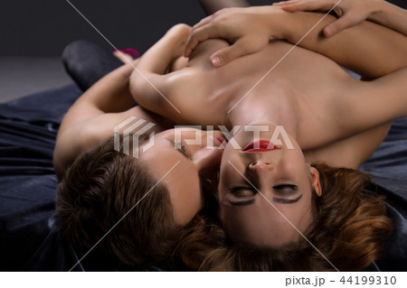 Beautiful nude couple wrapped in steamy embrace 44199310