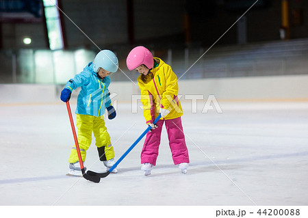 Children play ice hockey. Kids winter sport. 44200088
