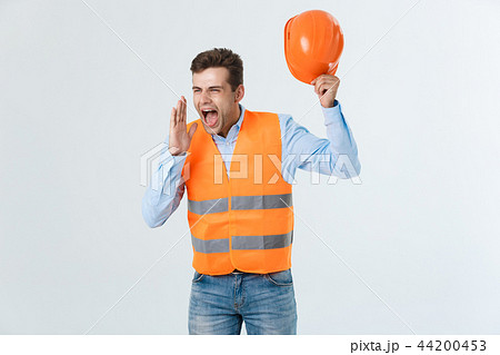 Angry builder or constructor yelling at somebody as fury concept isolated on white background with 44200453