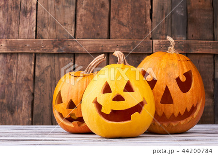 Traditional Halloween pumpkins on wooden background. Traditional Halloween pumpkins on wooden background. 44200784
