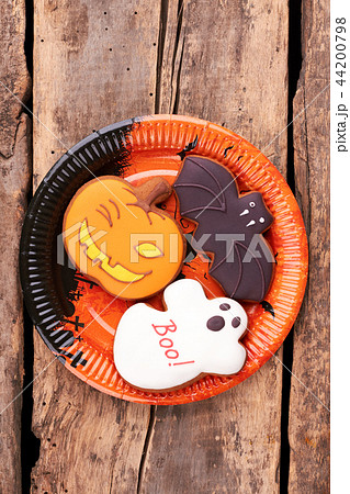 Plate with Halloween cookies on wooden background. Plate with Halloween cookies on wooden background. 44200798