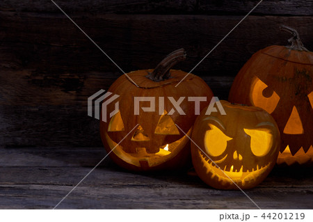 Scary glowing faces trick or treat. 44201219