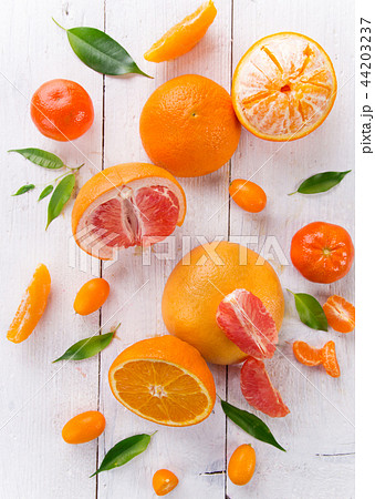 Citrus fruits on white wooden table. Citrus fruits on white wooden table. 44203237