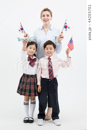 Children education. little boy and girl with native English-speaking teacher in white background 287 44203701