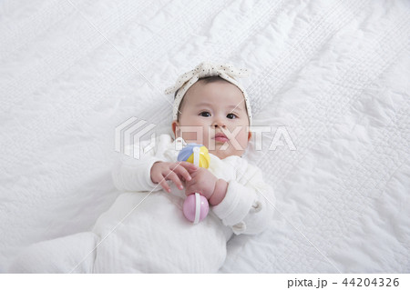 Young parents enjoying time spent with their little daughter, love and happy family concept photo 235 44204326