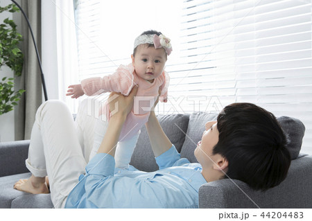 Young parents enjoying time spent with their little daughter, love and happy family concept photo 002 44204483