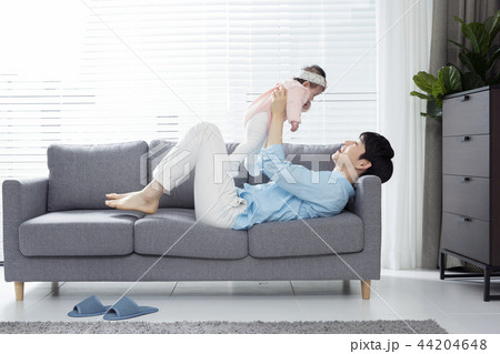 Young parents enjoying time spent with their little daughter, love and happy family concept photo 085 44204648