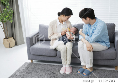 Young parents enjoying time spent with their little daughter, love and happy family concept photo 037 44204703