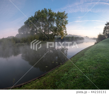 an misty morning at the water an misty morning at the water 44210131