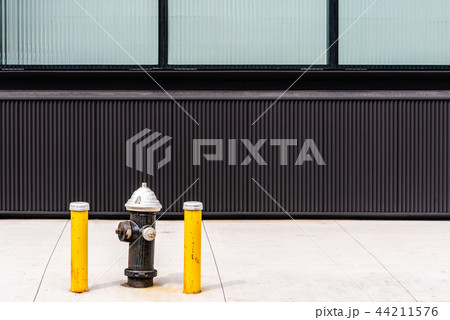 Fire hydrant against modern building 44211576