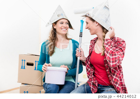 Two female friends renovating their new house 44214012