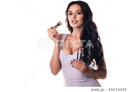 Portrait of beautiful woman with make-up brushes 44214485