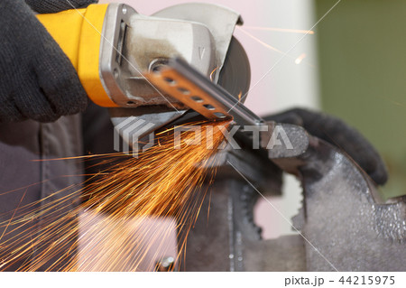 Cuts metal with a cutting machine. Close-up view 44215975