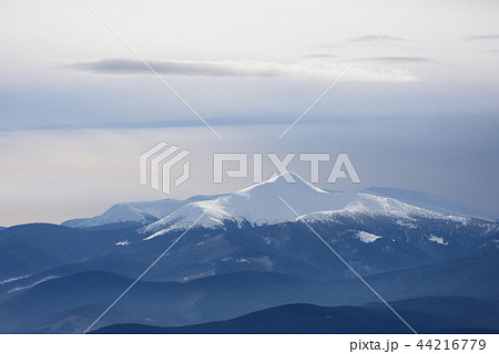 Mountain top under snow 44216779