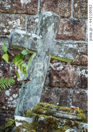 stoned cross on abandoned tomb in cemetery stoned cross on abandoned tomb in cemetery 44219092