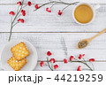 Tea, tea leaves on wooden spoon and biscuit 44219259