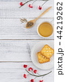 Tea, tea leaves on wooden spoon and biscuit 44219262