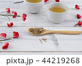 Tea and tea leaves on wooden spoon 44219268