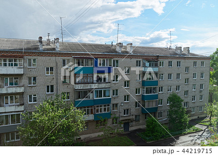 Old apartment house against amazing cloudy sky Old apartment house against amazing cloudy sky 44219715